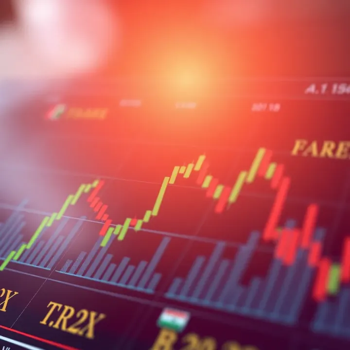 Chart showing fluctuations in forex currency pairs with tax symbols overlay